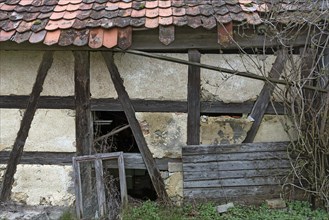 Dilapidated half-timbered building of a farm