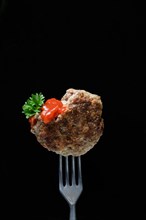 Homemade meatball on fork