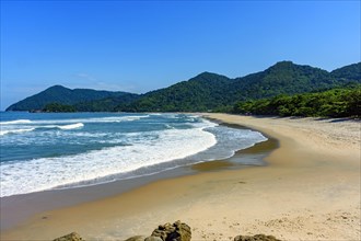 Beach in Bertioga on the north coast of the state of Sao Paulo surrounded by untouched forest and mountains