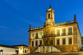 Historic building in Baroque style at dusk in the central square of the city of Ouro Preto in Minas Gerais