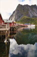 Traditional red rorbuer cabins in the fishing village of Reine