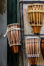 Atabaques displayed for sale in a musical instrument shop in Salvador in Bahia