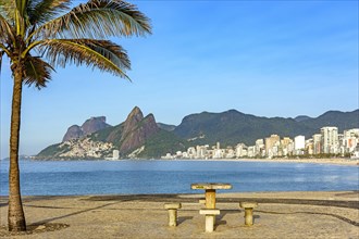 View of Ipanema beach in Rio de Janeiro on a summer morning with rocks