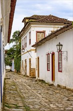 Bucolic street with old colonial-style houses and cobblestone pavement in the historic city of Paraty on the south coast of Rio de Janeiro