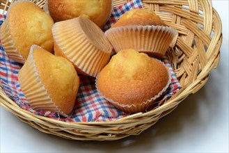 Several muffins in baskets