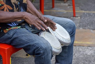 Bongos drum player in the streets of Salvador city during brazilian samba presentation