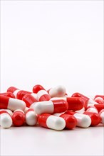 Various oval medicine pills on white background with free space