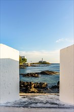 Barra Lighthouse seen through the walls of the old fortress of Santa Maria in the city of Salvador in Bahia