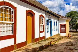 Cobbled street and colorful colonial-style houses in the old and historic city of Tiradentes in Minas Gerais