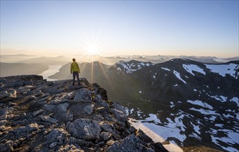 Hiker looking into the sunset