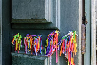Famous ribbons of good luck from Our Lord of Bonfim tied to the door of the church in Salvador