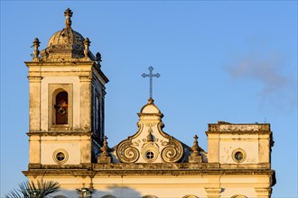 Details of historic bell tower and facade of old baroque church in Pelourinho district in Salvador city in Bahia at evening
