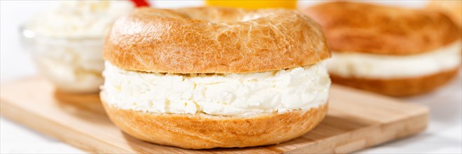Bagel sandwich for breakfast topped with cream cheese close-up panorama in Stuttgart