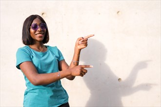 Finding Beauty in Simplicity: Young African American Tourist in Green T-Shirt and Sunglasses
