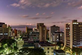 Belo Horizonte city and its constructions in the state of Minas Gerais during sunset with its buildings illuminated by the sun