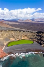 Green lake Charco de Los Clicos Verde near El Golfo in the Canary Islands Aerial view on the island of Lanzarote