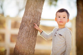 Outdoor portrait of a mixed-race chinese and caucasian boy