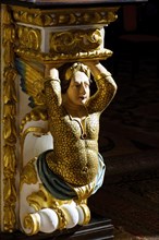 Column base with sculpture inside a baroque church from the 18th century in the Pelourinho neighborhood in the city of Salvador