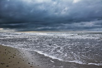 Dark rain clouds forming over North Sea ocean on island Texel in the Netherlands