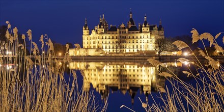 Illuminated Schwerin Castle in the evening