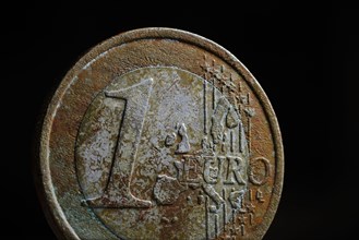 Symbol photo: Weathered 1 euro coin on a euro coin.Berlin