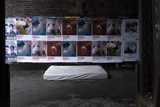 The mattress of a homeless man stands out under a bridge in Berlin