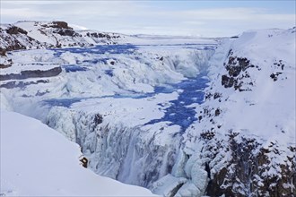 Gullfoss waterfall in the snow in winter located in the canyon of Hvita river