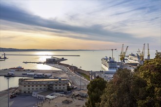 The Fincantieri shipyard in the industrial harbour at dusk