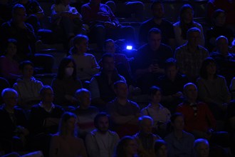 Spectators in blue light
