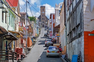 Street with shops and the Roman Catholic Cathedral at the capital city St. George's on the west coast of the island of Grenada