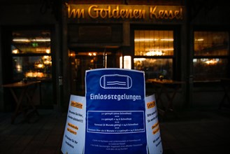 A sign outside a pub indicates the new catering access restrictions to combat the COVID-19 pandemic in Duesseldorf