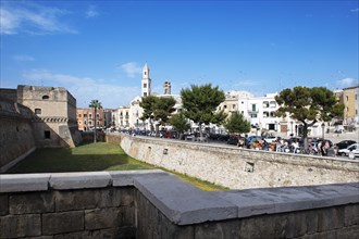 View over the moat of Castello Normanno-Svevo to the tower of San Sabino Cathedral in Bari