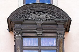 Detail of the historic oriel with pigeon grille