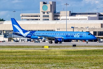 A Breeze Airways Embraer 195 aircraft with registration N193BZ at West Palm Beach Airport