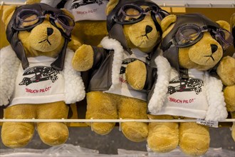 Three teddy bears in aviation goods