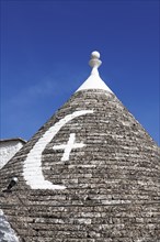 Trulli with symbol on the roof