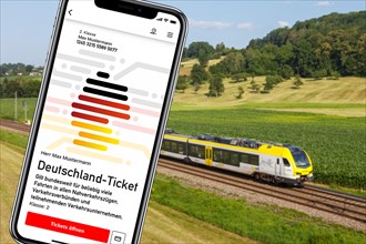 Germany ticket D-ticket or 49 euro ticket on a mobile phone with regional train Regional train photo montage in Uhingen