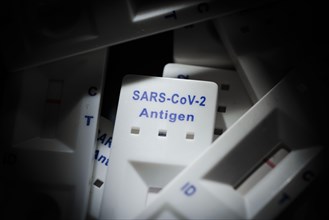 Negative SARS-CoV-2 Rapid Ag Antigen rapid tests lie on a table. Berlin