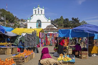 Market day in front of the Spanish colonial church of San Juan