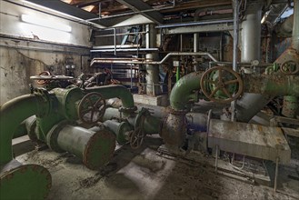 Water pipes in a machine room of a former paper factory