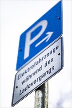 A parking sign for electric cars