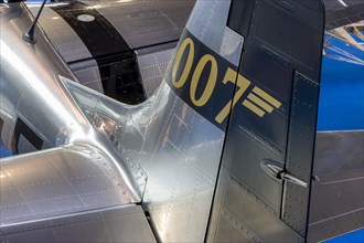 Detail of the rear part of the aircraft with the elevator and the inscription 007 on the rudder