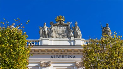 Golden Crown and Marble Statues on the Roof of the Albertina
