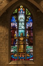 Stained-glass window in Necropolis with graves of Belgian World War One soldiers buried in the church of Grimde near Tienen
