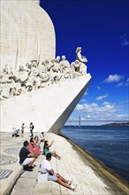 Tourists in front of the Monument to the Discoverers