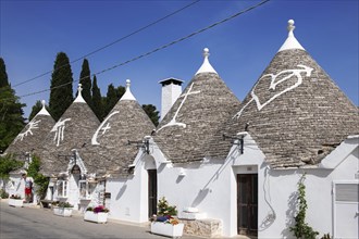 Trulli with symbols on the roof