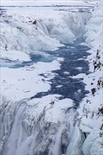 Gullfoss waterfall in the snow in winter located in the canyon of Hvita river