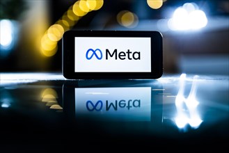 The logo of the technology company Meta stands out on a display in Berlin