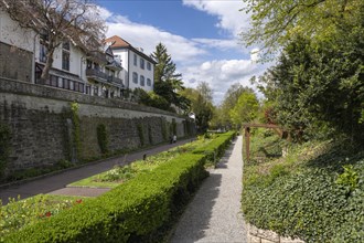 The town garden in the former moat of the historic old town of Radolfzell with spring-like vegetation