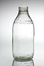 Empty clear glass milk bottle